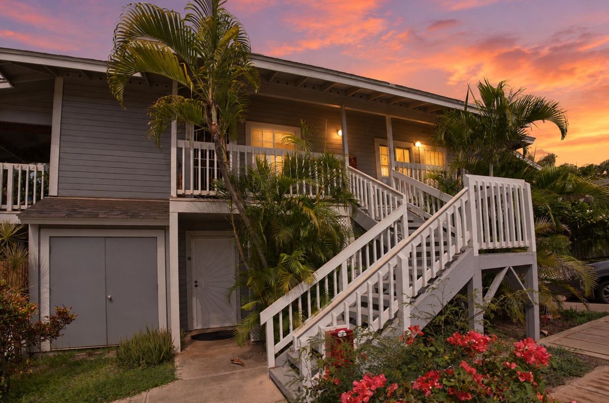 Keonekai Villages building 8 at sunset, with the stairway up to the second-floor residences